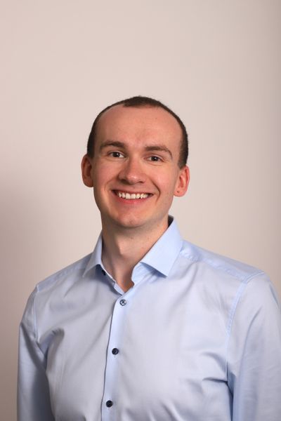 Illustrative stock portrait, not the reviewer